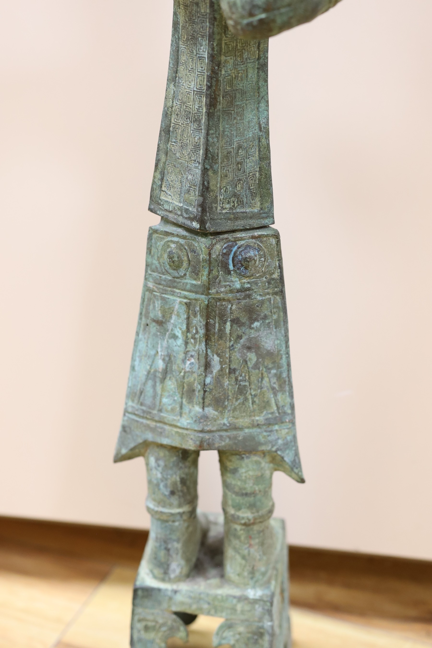 A large Chinese Shang style bronze figure, 73cm tall